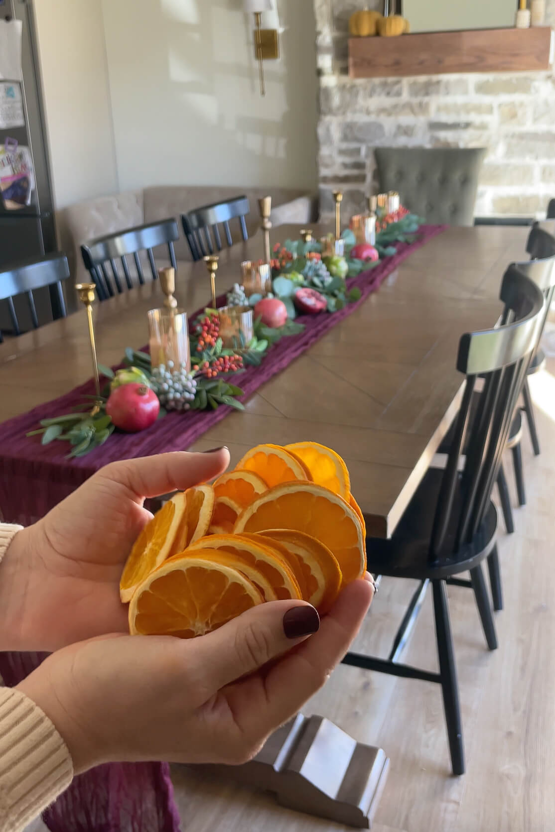 Decorating for Thanksgiving with dried orange slices.